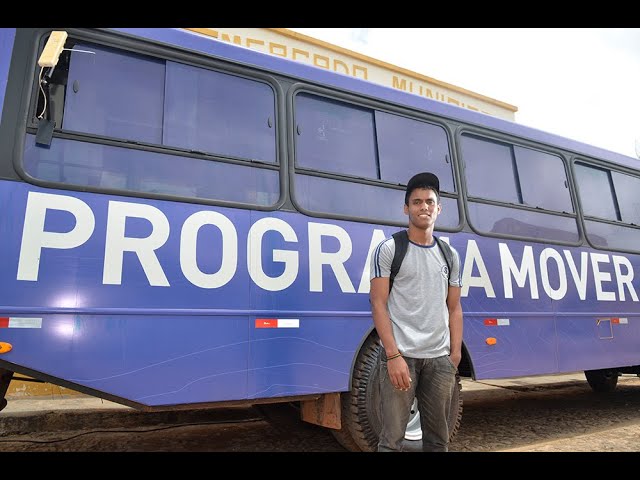 Student beside the professional training bus