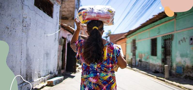 Gender equality woman carries basic basket on her head