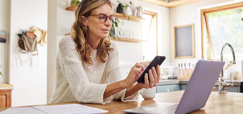 Secure Internet White woman using cell phone Photo: Adobe Stock