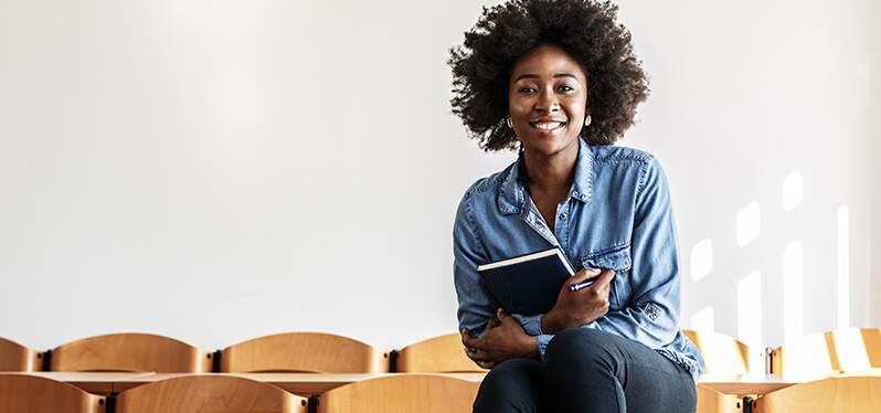 World Day of Social Justice. Black woman in the classroom. photo: adobe stock