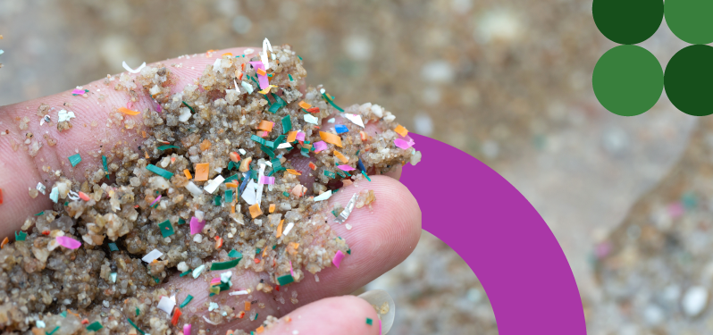 Environment Month - hand holds sand with microplastic.  Adobe Stock Photo